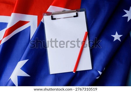 White empty paper copy space template mock up Australian flag background. National symbol and patriotism concept, ideal mock-up for custom copy designs. Place your logo or text on the white paper
