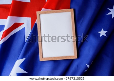 White empty paper copy space template mock up Australian flag background. National symbol and patriotism concept, ideal mock-up for custom copy designs. Place your logo or text on the white paper