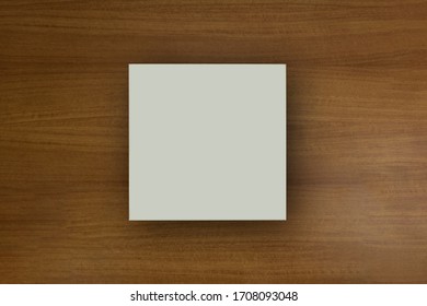 White empty paper square in dark background for mockup purposes