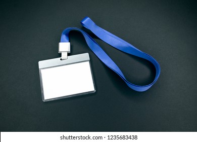 White Empty Staff Identity Mockup With Blue Lanyard. Name Tag, ID Card. Black Background