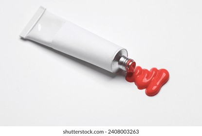 White empty tube of red acrylic or oil paint for creativity on white background. Template for design, mockup - Powered by Shutterstock