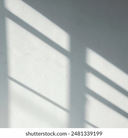 White empty wall with window shadow , perspective. Tropical leaves natural shadow overlay on white texture background, for overlay on product presentation, backdrop and mockup, summer seasonal concept
