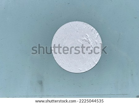 White empty worn street sticker on grey wall panel 