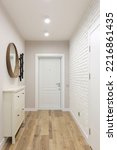 White entrance door inside an apartment in a modern interior