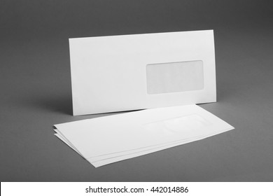 White Envelope With Address Window On Gray Background