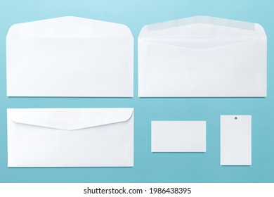 White Envelope Front And Back Isolated On Blue Background. Letter Top View. Object With Clipping Path