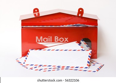 white envelope in red mail box