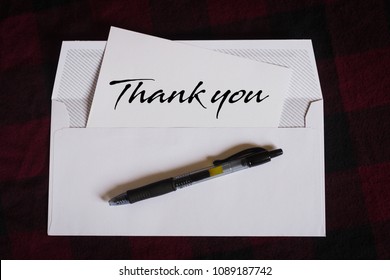 white envelope with thank you letter 