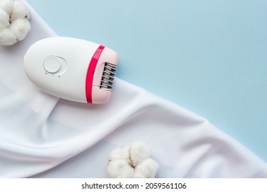 White epilator with cotton flowers for hair removal, top view - Shutterstock ID 2059561106