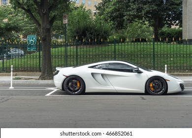 White Exotic Car Parked On A City Street