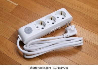 White Extension Cord With Three Outlets. Power Strip With Switch For Home Or Office.