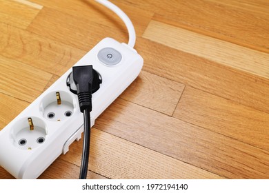 White Extension Cord With Three Outlets. Power Strip With Switch For Home Or Office.