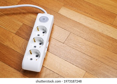 White Extension Cord With Three Outlets. Power Strip With Switch For Home Or Office.