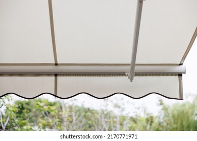 White Fabric Awning With The Garden Background. White Canvas Sun