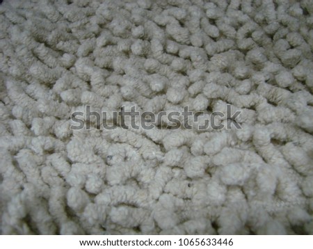 White fabric carpet with long pile texture background