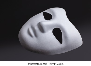White Face Mask On Black Background