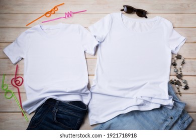 White Family Look Cotton T-shirt Mockup With Necklace, Sunglasses, Jeans And Decorative Cocktail Drinking Straws. Design T Shirt Set Template, Tee Print Presentation Mock Up