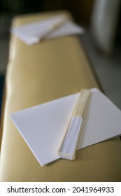 White Fan On The Pew Of A Church During The Wedding