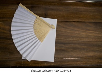 White Fan On The Pew Of A Church During The Wedding