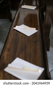 White Fan On The Pew Of A Church During The Wedding