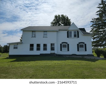 White Farmhouse On A Beautiful Sunny Day