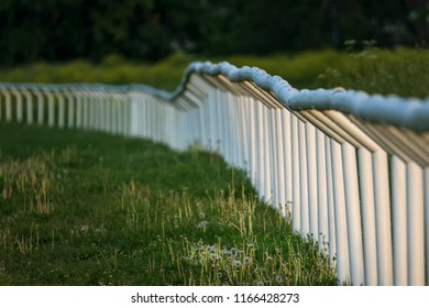 White Fence Surrounding Horse Racing Track