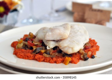  White Fish With A Sauce Of Roasted Peppers And  Ratatouille