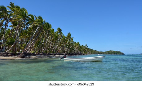 White Fishing Boat On A Tropical Island In The Yasawa Islands Group, Fiji