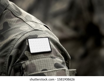 White flag on military uniform. White flag is sign of truce or surrender or ceasefire, and request for negotiation. Army, armed forces, soldiers, war and peace.