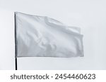 White flag waving on white background.