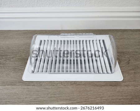 white floor vent with cover