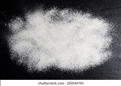 White Flour On A Black, Stone Table.