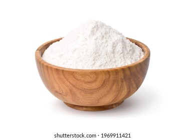 White flour in wooden bowl isolated on white background. Clipping path.