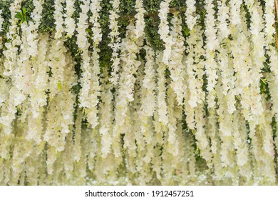 white flower garlands hanging from ceiling