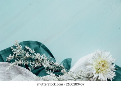 White Flower And Linen Border On Light Teal Background With Copy Space