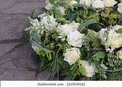White Flowers After A Funeral In The Cemetery