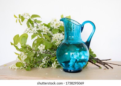 White Flowers In Blue Glass Vase