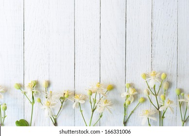 White Flowers And Buds On Wood Background