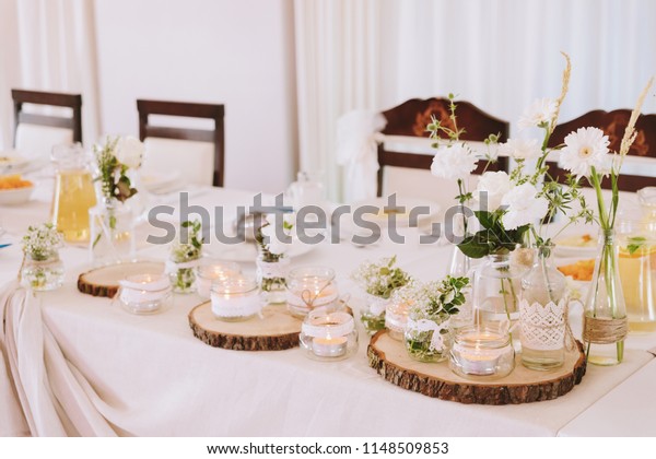 White Flowers Glass Candles Wood Lace Royalty Free Stock Image