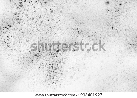 White foam background, soap froth bubbles texture, lather surface, detergent, laundry spume, hygiene soap sud, cosmetic cleanser, shampoo, shower gel, foamy bathtub, sea water foam, ocean wave froth