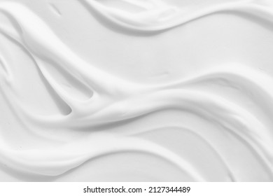 White foam cream texture. Cosmetic cleanser, shower gel, shaving foam background. Creamy cleansing skincare product bubbles