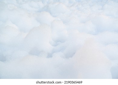 white foam for foam party. dancing to music on a dance floor covered with a few feet of foam or bubbles emitted from the foaming agent. background and texture.