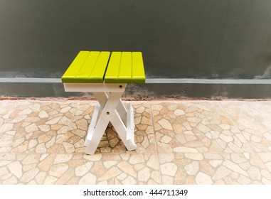 White folding chairs placed outside the home. - Shutterstock ID 444711349