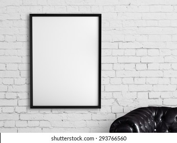 White Frame Hanging On A Brick Wall