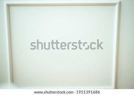 White frame on white background. Modern photo frame, blank white border frame, Blank photo frame on white wall template minimal concept.