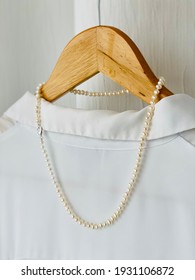 White Freshwater Pearl Necklace On Wooden Hanger