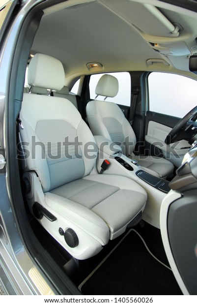 White front seats in\
a large passenger car