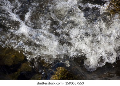 White Frothy Water From An Urban Storm Water Drain  Pours Into The Leschenault Estuary , Bunbury, Western Australia  On A Late Afternoon In  Spring.