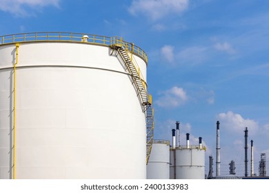 White fuel oil storage tank with blue sky background, Storage tank important infrastructure for oil and gas, The storage tank place to receive and store oil at fuel terminal, Oil and Gas storage tank.