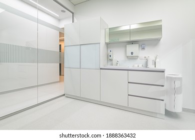 White Furniture In Modern Dentistry Medical Room With Special Equipment